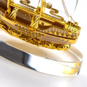 Golden Boat Shaped Memento in Metal with Glass Base in Luxury Box — related custom branded product in UAE