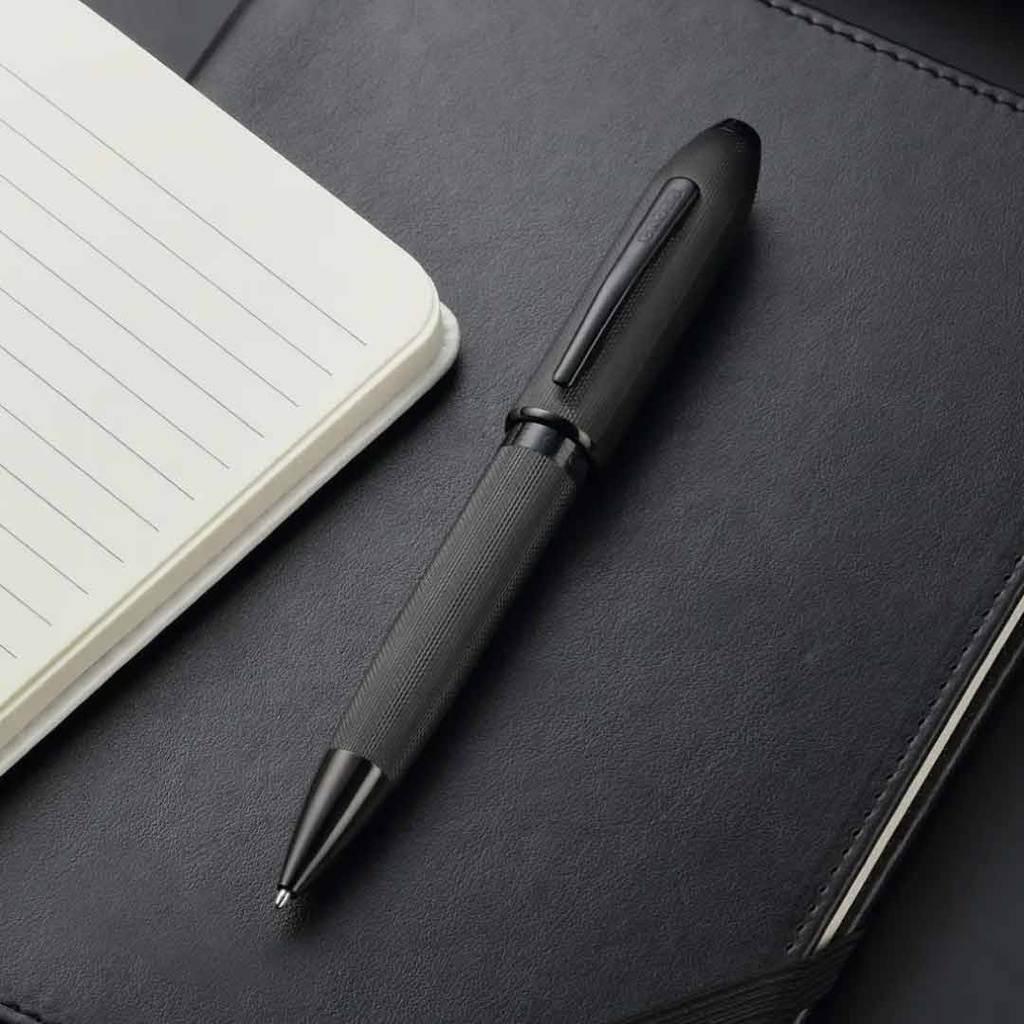 Cross Peerless black PVD ballpoint pen on notebook
