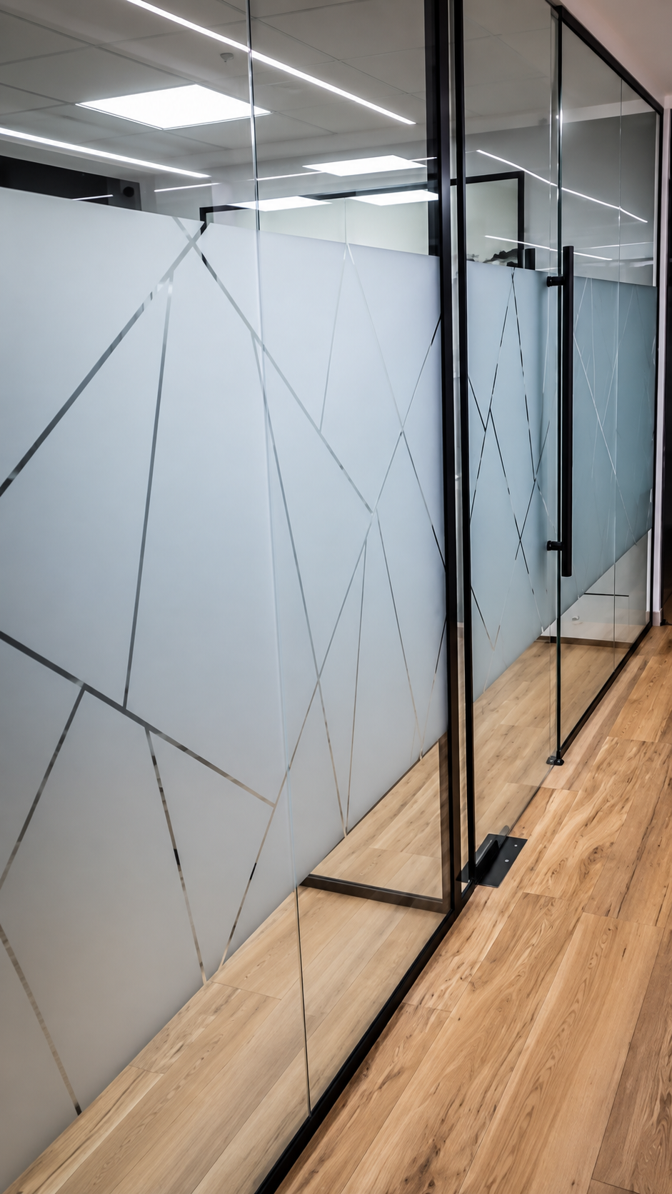 Office partition measured for strip-cut sandblast privacy bands